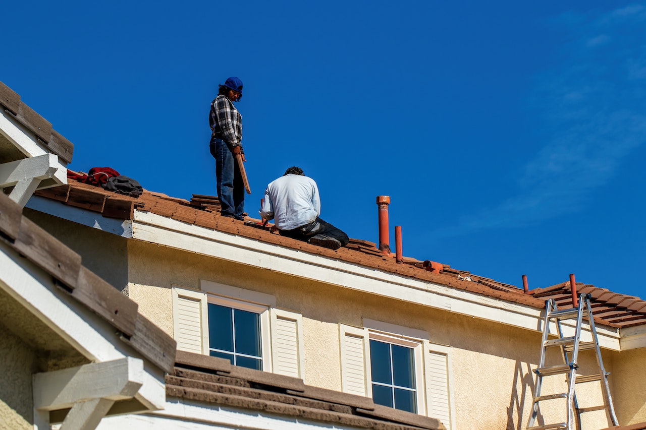 men working on roof